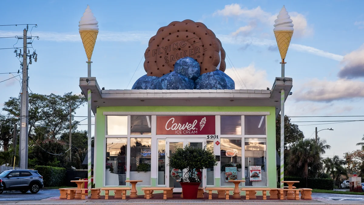 A giant inflatable ice cream sandwich on the roof of an ice cream shop