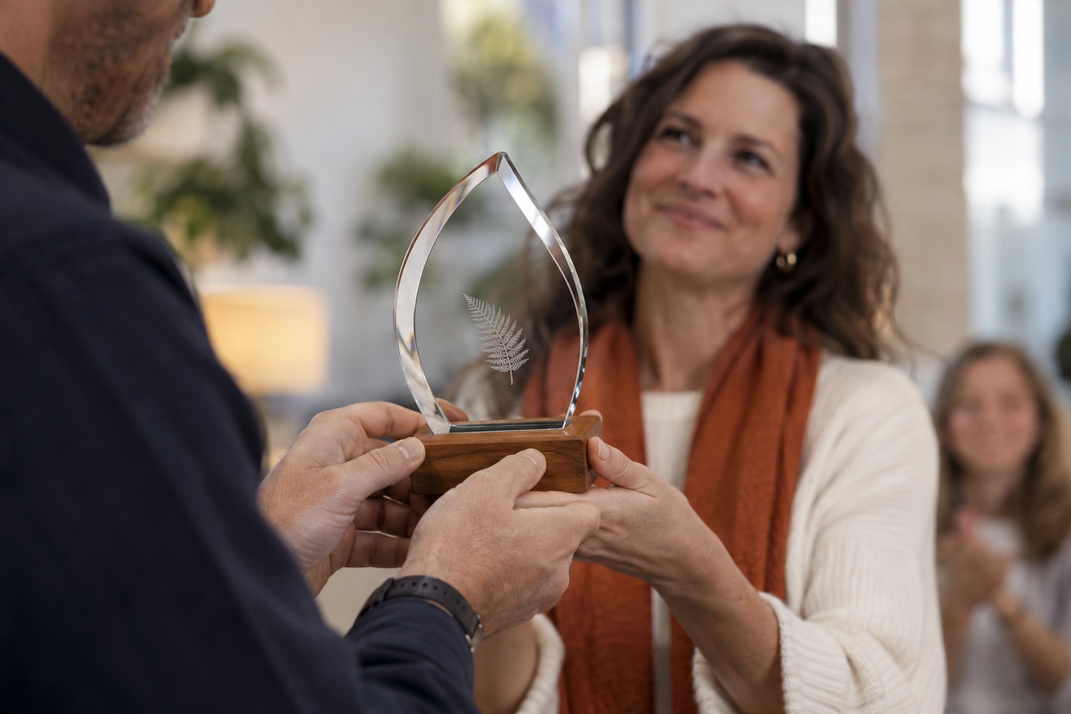Cinematic artwork of a crystal award being handed to a smiling recipient at a team celebration