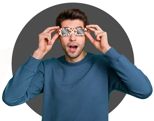 Man named Adam trying on custom-branded eclipse glasses.